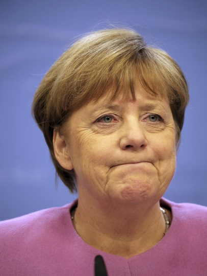 The Latest: May says she is no Thatcher despite EU stance