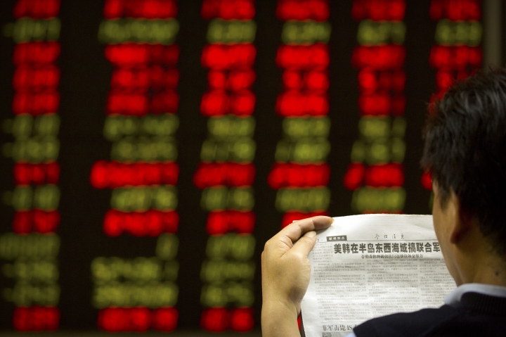Global stocks mixed amid upbeat corporate earnings